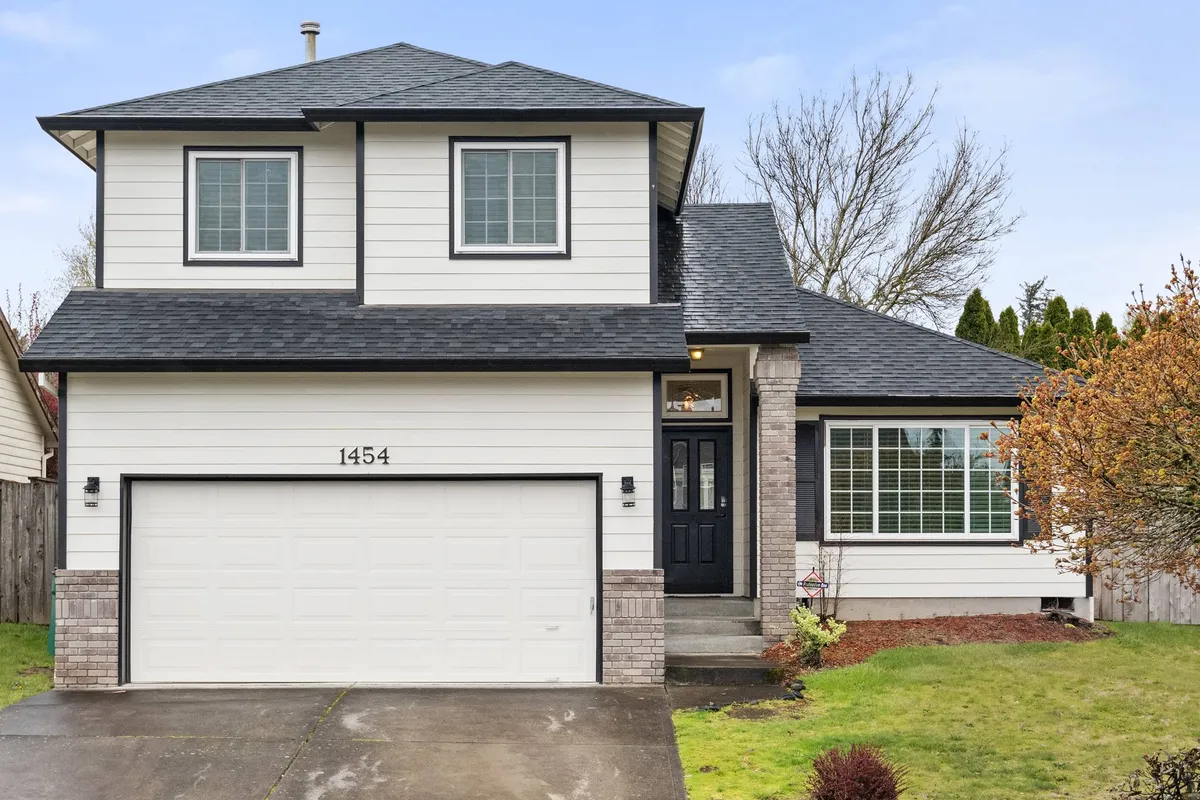 This exterior image showcases the welcoming front view of the home, highlighting the front door, garage, large windows, and meticulously maintained landscaping. Children are seen playing in the yard, and the mood is inviting and family-oriented.